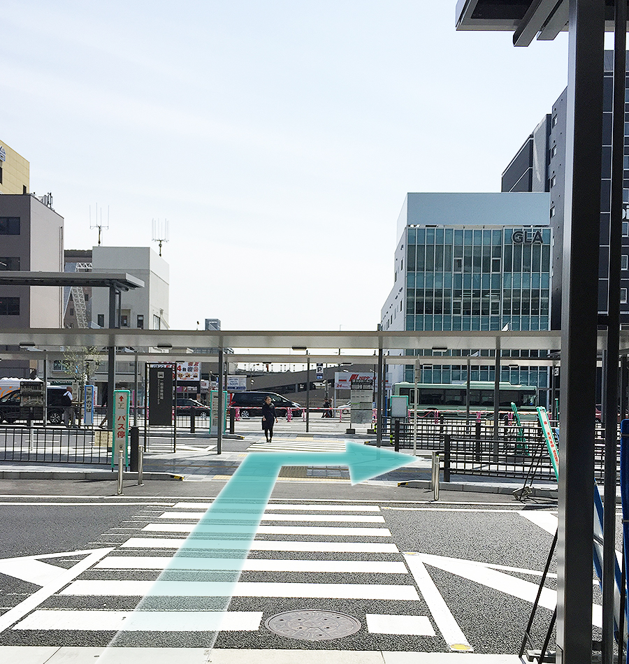 Cross two short crosswalks.